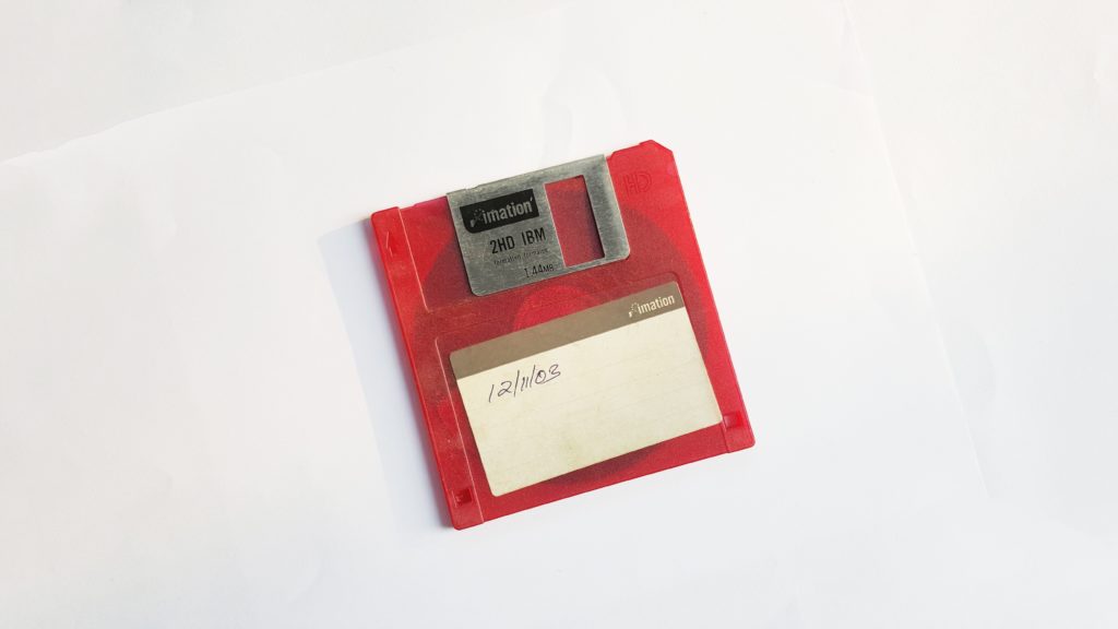 Floppy disk red on white background