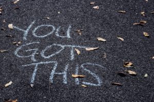 Chalk writing on pavement "You Got This"